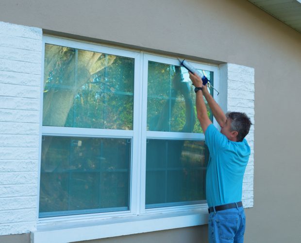Air sealing the window to keep the property dry and prevent any moisture from accumulating inside the house