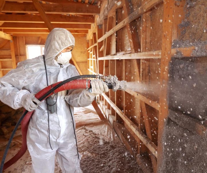 A professional performing Spray Foam Insulation for weatherization