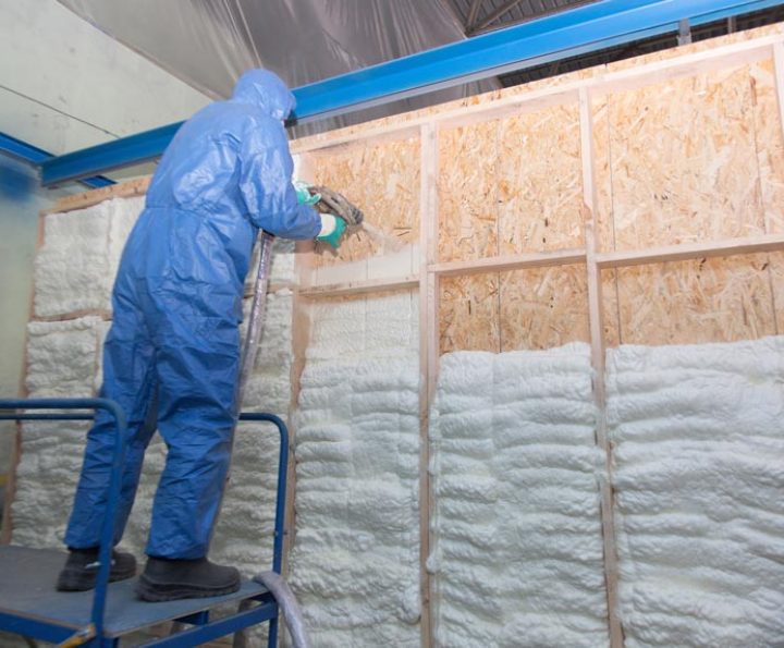 Foam Thermal Insulation Installation done by a professional in full protective gear